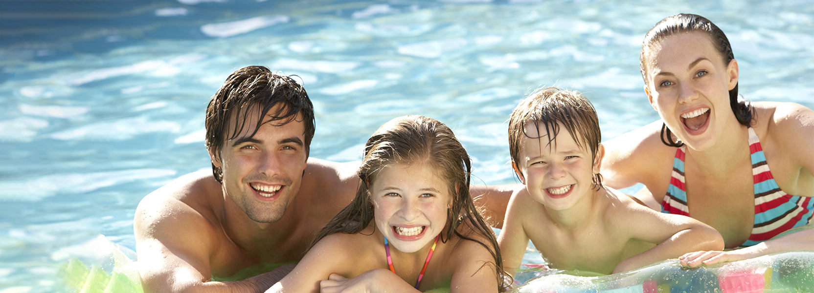 Family in Pool Smiling